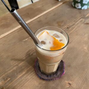 A glass of oat milk latte in a vegan coffee shop in Hanoi